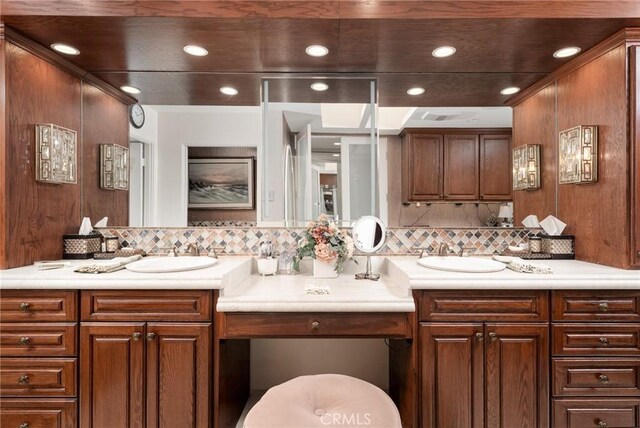 bathroom featuring backsplash and vanity