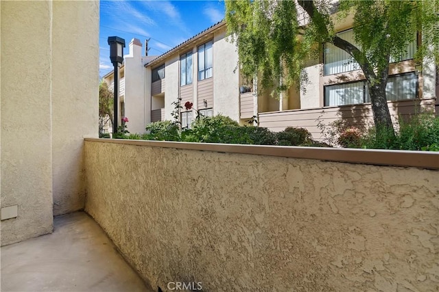 view of side of property featuring a balcony