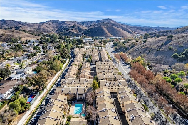 birds eye view of property featuring a mountain view