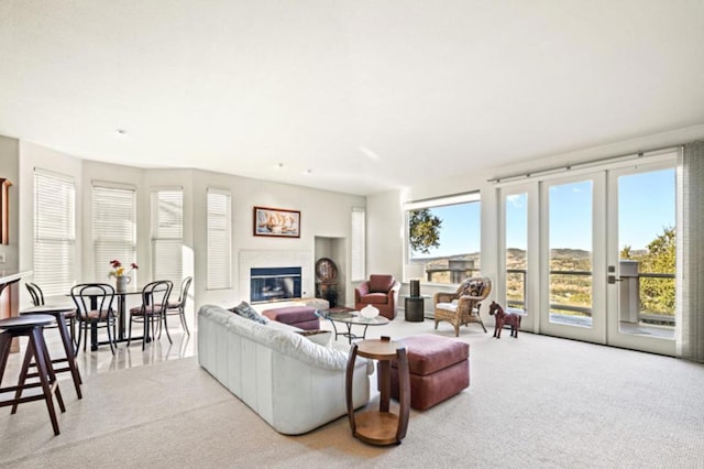 living room featuring light carpet and french doors