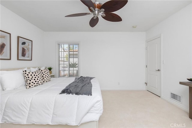 bedroom featuring ceiling fan and light colored carpet