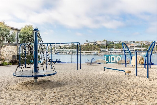 view of jungle gym with a water view