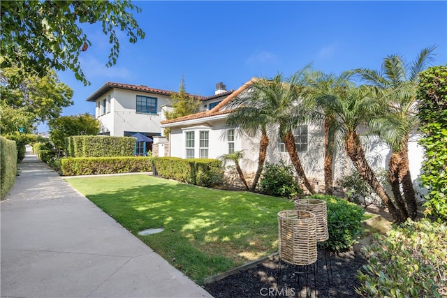 view of front of home with a front lawn