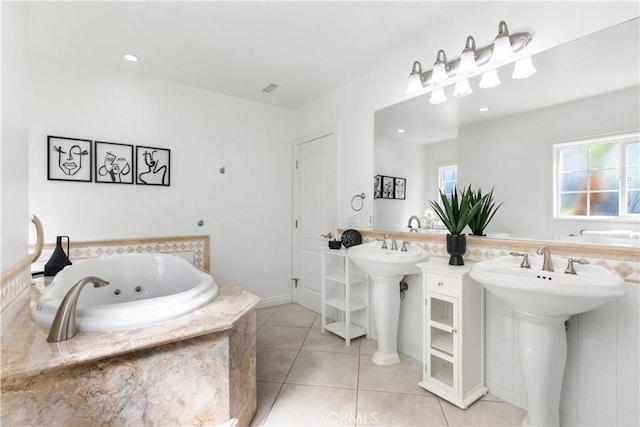 bathroom featuring tile patterned flooring and a relaxing tiled tub