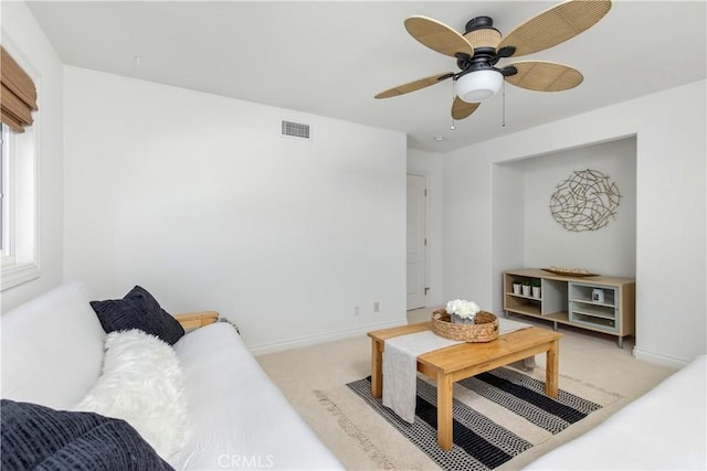 living room with light carpet and ceiling fan