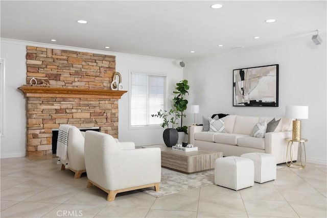 living room featuring ornamental molding, a stone fireplace, and light tile patterned flooring