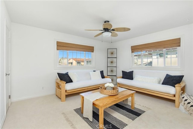 living room with ceiling fan and light colored carpet