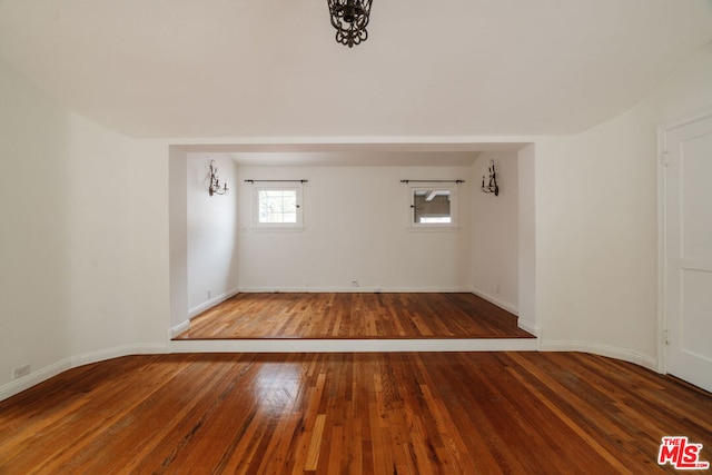 spare room with wood-type flooring