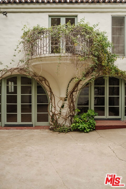 doorway to property featuring a patio area and a balcony