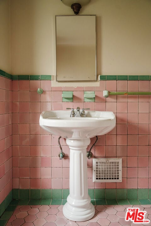 bathroom featuring tile walls and tile patterned flooring