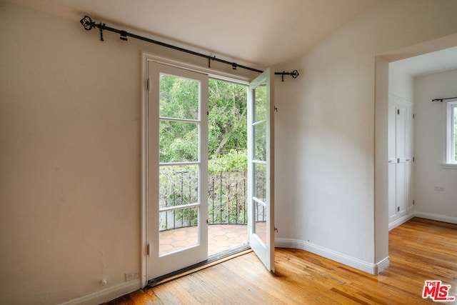 doorway with light wood-type flooring