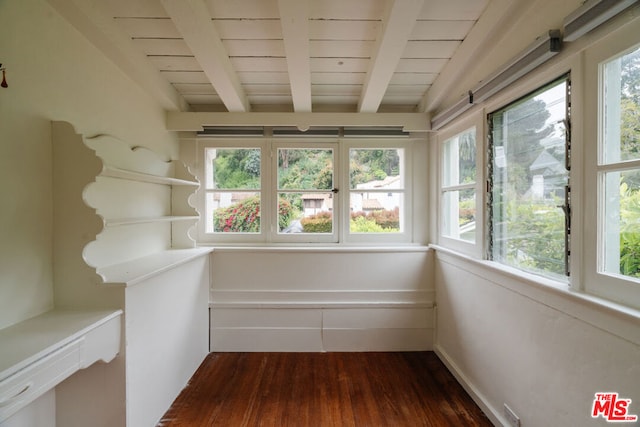 unfurnished sunroom featuring wooden ceiling and lofted ceiling with beams