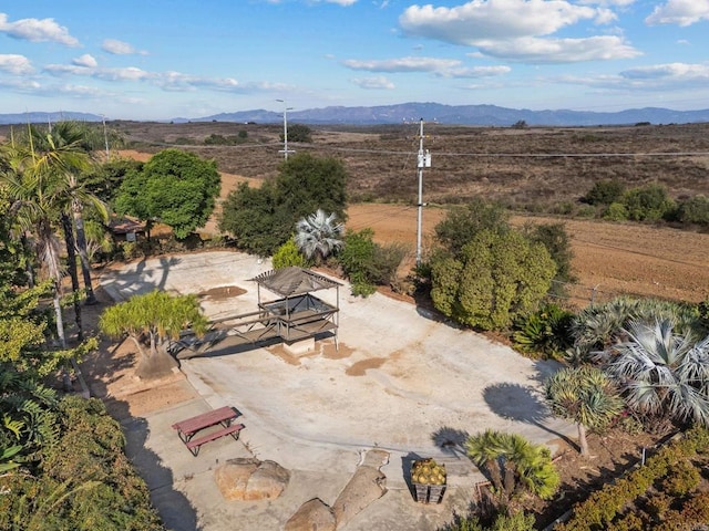 drone / aerial view featuring a mountain view