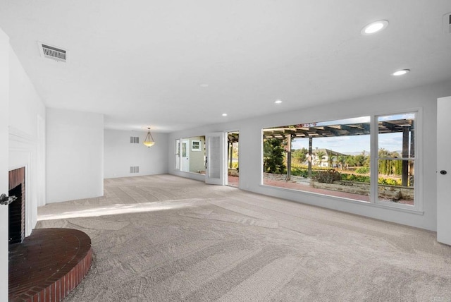 carpeted living room with a fireplace