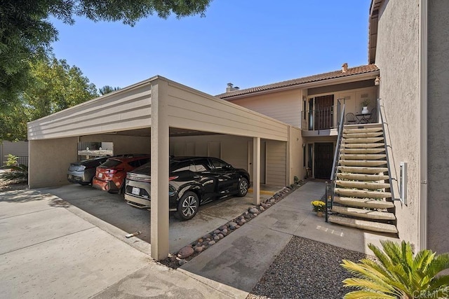 view of vehicle parking featuring a carport