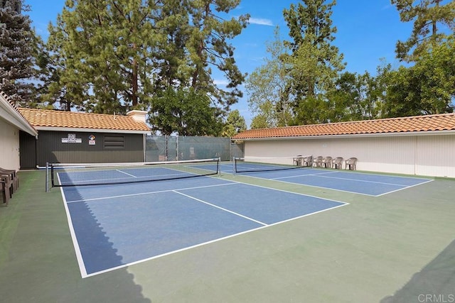 view of tennis court featuring basketball court