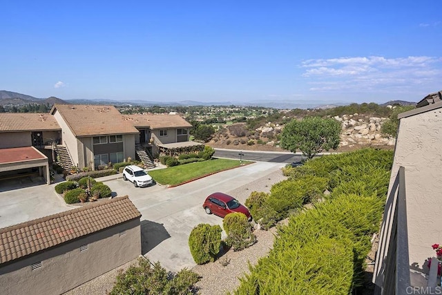 birds eye view of property with a mountain view