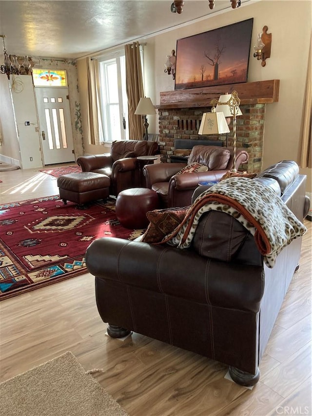 living room with a fireplace and light hardwood / wood-style flooring