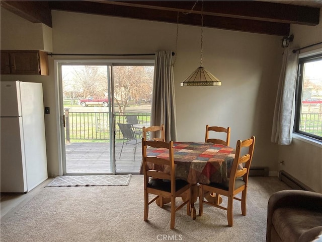 carpeted dining room with a baseboard radiator and beam ceiling