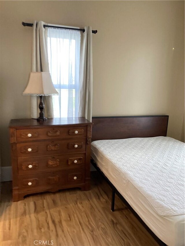 bedroom featuring light hardwood / wood-style flooring