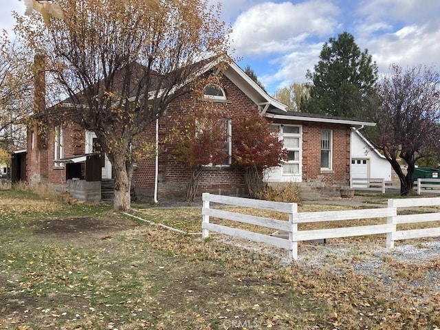 view of side of property featuring a garage