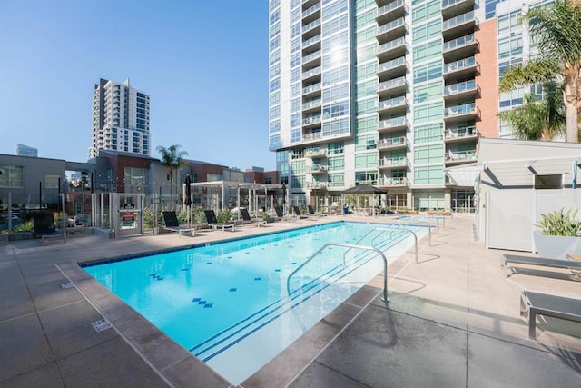 view of swimming pool featuring a patio area