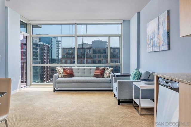 living room featuring expansive windows, light carpet, and a healthy amount of sunlight