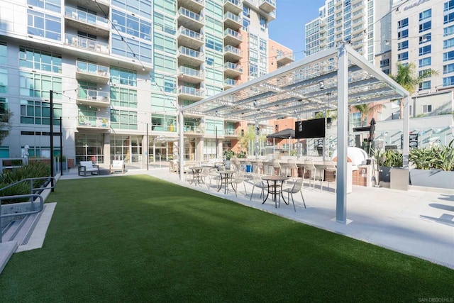 exterior space featuring a lawn and a pergola