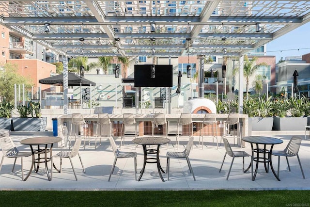 view of patio / terrace with a fireplace and a pergola