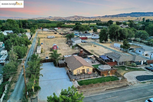 aerial view at dusk with a mountain view