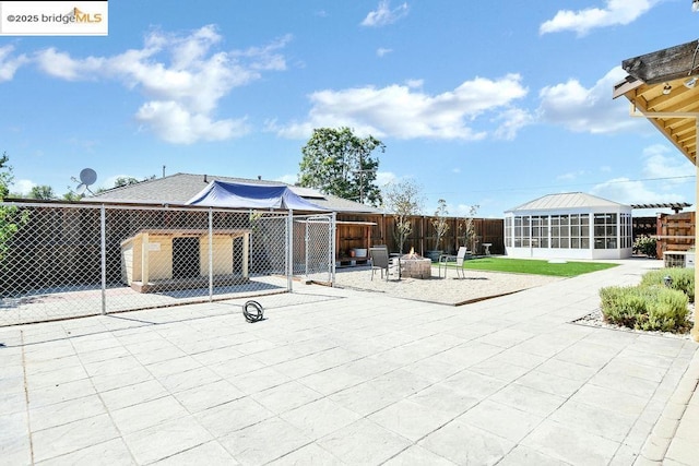 view of patio / terrace featuring a fire pit