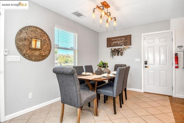 dining area with light tile patterned floors