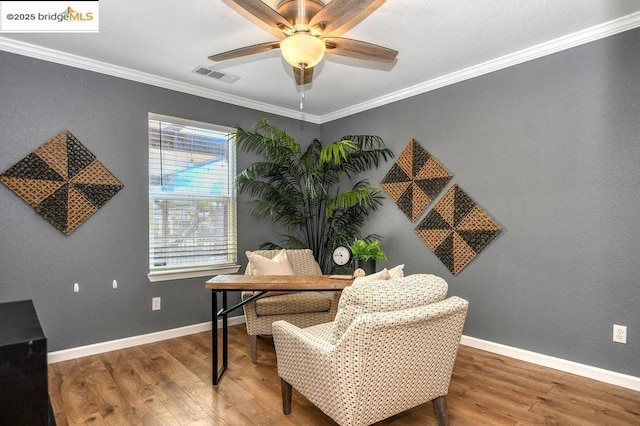 office with ceiling fan, wood-type flooring, and ornamental molding