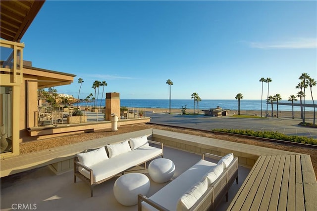 exterior space featuring an outdoor living space and a water view