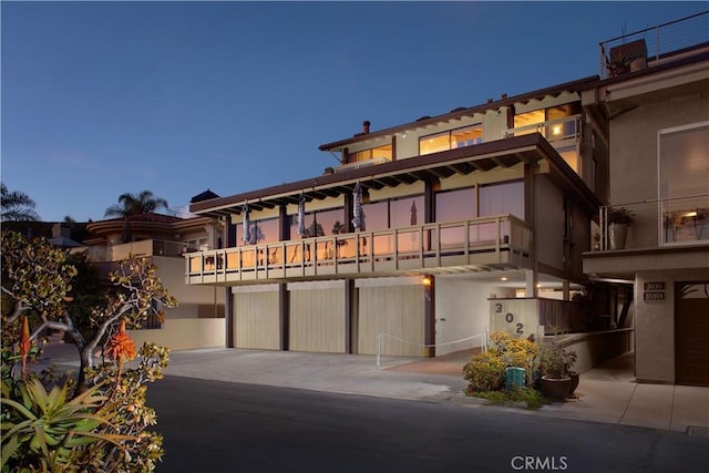 3024 Breakers Dr, Corona Del Mar, CA 92625 - view of front of home with a balcony and stucco siding