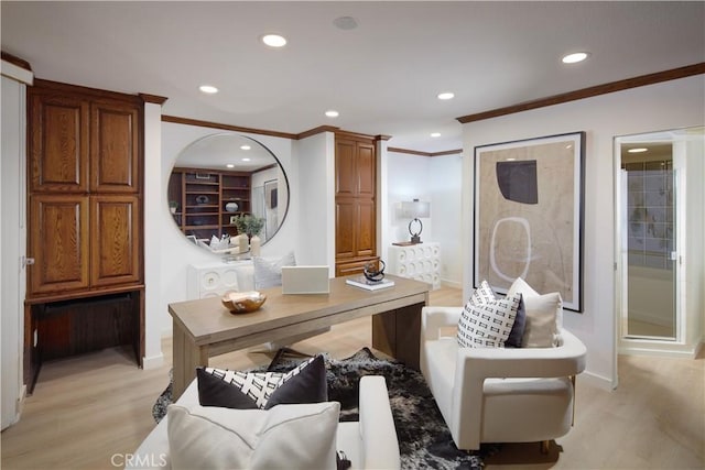 office space with light wood-type flooring and ornamental molding