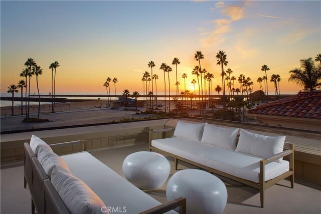 patio terrace at dusk with an outdoor hangout area