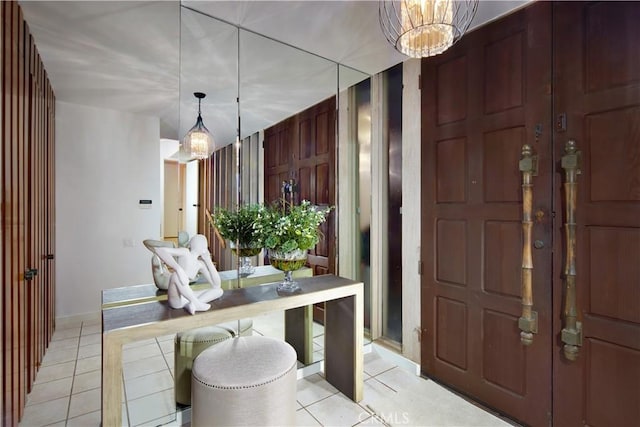 3024 Breakers Dr, Corona Del Mar, CA 92625 - entrance foyer featuring baseboards, light tile patterned floors, and a notable chandelier