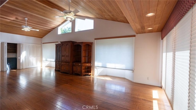 unfurnished room featuring wooden ceiling, light hardwood / wood-style floors, a towering ceiling, and ceiling fan