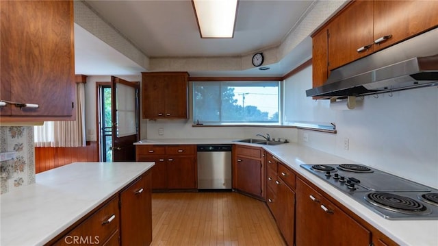 kitchen with dishwasher, sink, electric cooktop, and light hardwood / wood-style floors