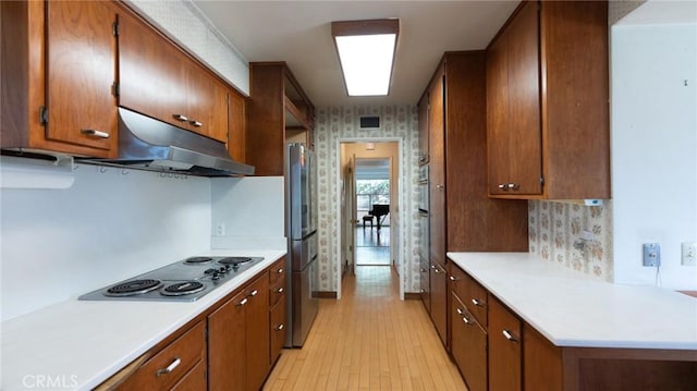 kitchen featuring stainless steel appliances and light wood-type flooring