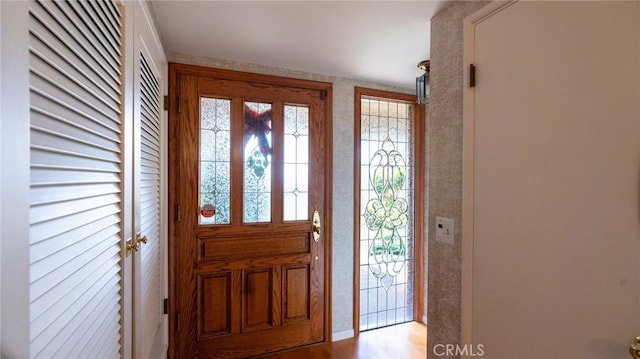 foyer entrance with light wood-type flooring