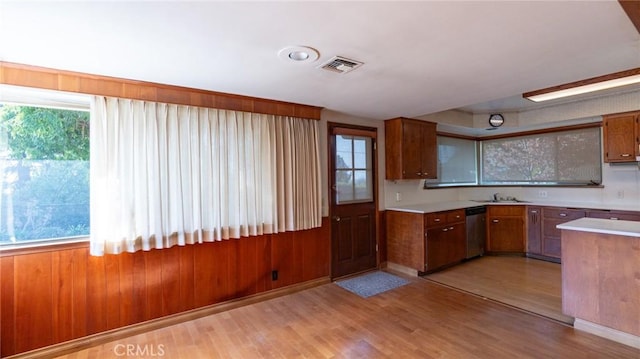 kitchen featuring light hardwood / wood-style floors, sink, and dishwasher