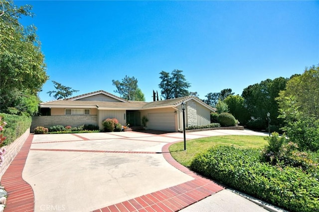 single story home with a garage