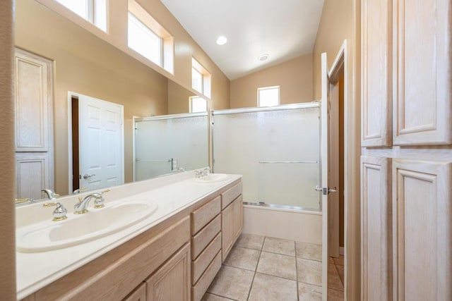 bathroom with tile patterned flooring, vanity, vaulted ceiling, and shower / bath combination with glass door