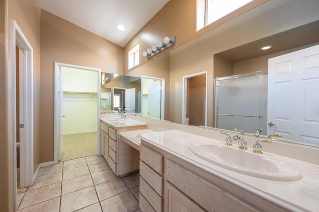 bathroom featuring an enclosed shower, vanity, tile patterned floors, and high vaulted ceiling