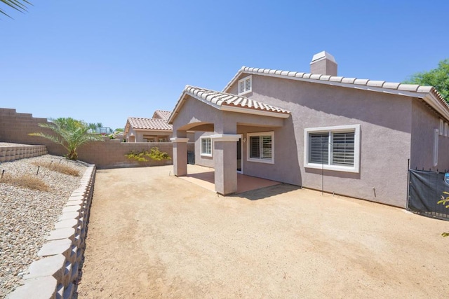 back of house with a patio area