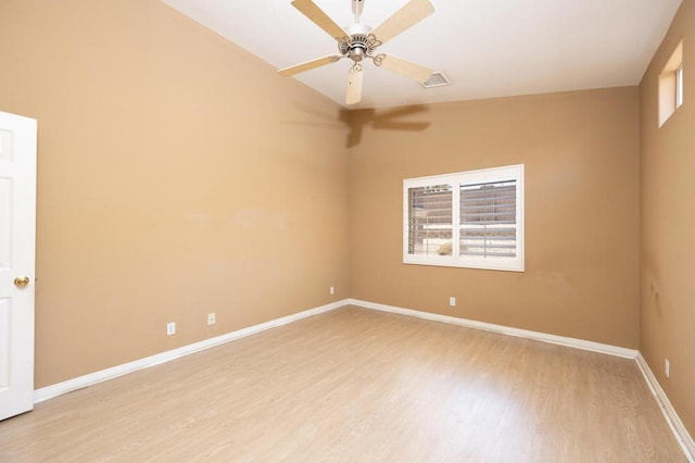 empty room with ceiling fan and light hardwood / wood-style floors