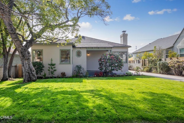 ranch-style home with a front lawn