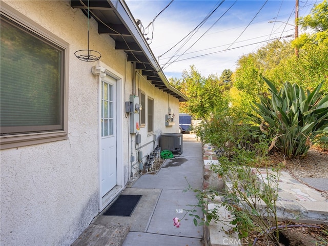 view of property exterior with central AC